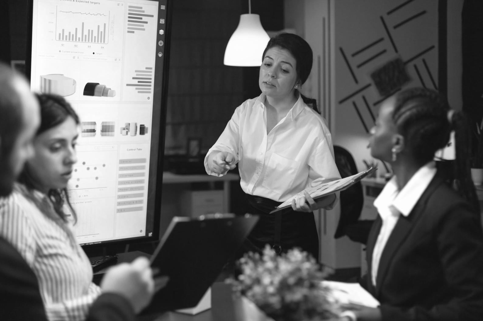 Professional analyzing financial documents with charts and graphs